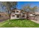 View of the backyard with nice green grass and two trees in view at 5313 W Jessica Ln Ln, Laveen, AZ 85339