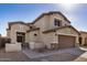 Front exterior showcasing a two-story home with well-maintained landscaping and modern architectural details at 5313 W Jessica Ln Ln, Laveen, AZ 85339