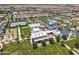 Aerial view of the community highlighting the clubhouse, community pool, tennis courts, and well-maintained landscaping at 5431 S Canyon Rim --, Mesa, AZ 85212