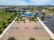 An aerial view shows a well-maintained basketball court and playground with parking in a luxury neighborhood at 5431 S Canyon Rim --, Mesa, AZ 85212