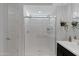 Modern bathroom showcasing a glass-enclosed shower with white tiles and a bright interior at 5431 S Canyon Rim --, Mesa, AZ 85212