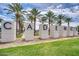 Entrance to Cadence Community is marked by a sign surrounded by lush palm trees and manicured lawns at 5431 S Canyon Rim --, Mesa, AZ 85212