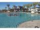 Community pool area with inviting loungers, umbrellas, and a water fountain, perfect for relaxation and recreation at 5431 S Canyon Rim --, Mesa, AZ 85212