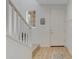 Welcoming foyer with a side staircase, white trim and wood-look floors at 5431 S Canyon Rim --, Mesa, AZ 85212