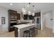 Sleek kitchen with a center island, stainless steel appliances, and dark wood cabinetry at 5431 S Canyon Rim --, Mesa, AZ 85212