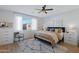 Serene main bedroom features neutral tones, a ceiling fan, and abundant natural light at 5431 S Canyon Rim --, Mesa, AZ 85212