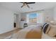 Relaxing main bedroom features a ceiling fan and large windows for natural light at 5431 S Canyon Rim --, Mesa, AZ 85212