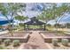 Scenic view of a park featuring a covered pavilion, playground, and lush landscaping for community enjoyment at 5431 S Canyon Rim --, Mesa, AZ 85212