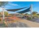 Colorful playground with various play structures, designed for active children, in a well-kept community park at 5431 S Canyon Rim --, Mesa, AZ 85212