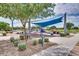 Fun playground featuring colorful play structures and soft play areas, perfect for children, with shaded canopy at 5431 S Canyon Rim --, Mesa, AZ 85212