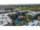 Scenic aerial view of community buildings, showcasing a pool, landscaping, and nearby golf course at 5450 E Deer Valley Dr # 3008, Phoenix, AZ 85054