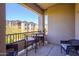 Cozy outdoor patio space with cushioned seating and views of the neighborhood at 5450 E Deer Valley Dr # 3008, Phoenix, AZ 85054