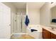 Bathroom featuring a soaking tub, glass shower, and a wooden vanity at 5450 E Deer Valley Dr # 3008, Phoenix, AZ 85054