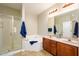 Bathroom featuring a soaking tub, glass shower, and double sinks in the vanity at 5450 E Deer Valley Dr # 3008, Phoenix, AZ 85054