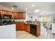 Well-lit kitchen featuring tile floors, granite counters, a gas range, and black appliances at 5450 E Deer Valley Dr # 3008, Phoenix, AZ 85054