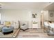 Bright and airy living room featuring wood floors, neutral walls, a ceiling fan, and stylish furniture at 5450 E Deer Valley Dr # 3008, Phoenix, AZ 85054