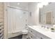 Bright bathroom featuring a shower over tub combination and vanity with quartz countertop at 6132 E Yucca St, Scottsdale, AZ 85254