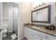 Bright bathroom featuring granite countertops, tile flooring, and a glass-enclosed shower at 6132 E Yucca St, Scottsdale, AZ 85254