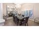 Dining room featuring hardwood floors, a modern chandelier, and mirrored wall decor at 6132 E Yucca St, Scottsdale, AZ 85254