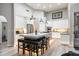 Modern kitchen featuring a large island with seating, pendant lighting, and stainless steel appliances at 6132 E Yucca St, Scottsdale, AZ 85254