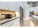 Kitchen counter details include white cabinets, stainless steel appliances, and tiled backsplash at 6132 E Yucca St, Scottsdale, AZ 85254