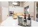 Kitchen island detail showcases pendant lighting, fruit bowl, and countertop wine rack at 6132 E Yucca St, Scottsdale, AZ 85254