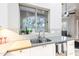 Kitchen features a garden window above the sink, providing natural light and greenery at 6132 E Yucca St, Scottsdale, AZ 85254