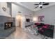 This living room features a cozy fireplace, stylish decor, and neutral colors at 6132 E Yucca St, Scottsdale, AZ 85254