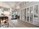 Bright living room with hardwood floors, white shutters, and seamless indoor-outdoor flow at 6132 E Yucca St, Scottsdale, AZ 85254