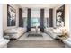 Bright living room featuring hardwood floors, modern art, large windows and two sofas facing each other at 6132 E Yucca St, Scottsdale, AZ 85254