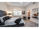 Stylish main bedroom featuring tray ceiling, large window, and ensuite bathroom at 6132 E Yucca St, Scottsdale, AZ 85254