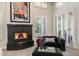 This main bedroom boasts a black fireplace, comfortable seating, and abundant natural light at 6132 E Yucca St, Scottsdale, AZ 85254