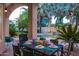 Inviting outdoor dining area overlooking the pool, with palm trees and landscape lighting at 6132 E Yucca St, Scottsdale, AZ 85254