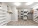 Spacious walk-in closet featuring custom shelving and ample storage at 6132 E Yucca St, Scottsdale, AZ 85254