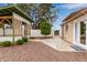 Serene backyard with a gazebo, a lush citrus tree, gravel and a connecting walkway at 641 N 61St Pl, Mesa, AZ 85205