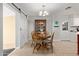 Cozy dining room with a round table, wooden chairs, and a decorative chandelier at 641 N 61St Pl, Mesa, AZ 85205