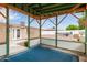 Inside a shaded gazebo, enjoy the view of the backyard, boat, and cozy ambiance with colorful lights at 641 N 61St Pl, Mesa, AZ 85205