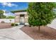 Landscaped backyard featuring a gazebo, gravel groundcover and a citrus tree for aesthetic appeal at 641 N 61St Pl, Mesa, AZ 85205