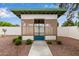 Backyard gazebo with screened walls and a blue rug, surrounded by gravel and green bushes at 641 N 61St Pl, Mesa, AZ 85205