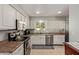 Functional kitchen featuring white cabinets, laminate countertops and tile flooring at 641 N 61St Pl, Mesa, AZ 85205