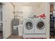 Functional laundry room with modern washer and dryer units at 641 N 61St Pl, Mesa, AZ 85205