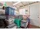 A finished storage area with organized plastic containers, shelves and a white door at 641 N 61St Pl, Mesa, AZ 85205