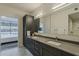 Modern bathroom with dual sinks, sleek cabinetry, and a luxurious walk-in shower with marble-like tiling at 7180 E Kierland Blvd # 807, Scottsdale, AZ 85254