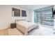 Bedroom with hardwood floors, modern décor and a view of the city skyline at 7180 E Kierland Blvd # 807, Scottsdale, AZ 85254