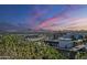 Breathtaking city and mountain views at sunset; lush greenery in the foreground adding to the serenity at 7180 E Kierland Blvd # 807, Scottsdale, AZ 85254