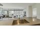 Living room featuring a sink, expansive windows, and natural light at 7180 E Kierland Blvd # 807, Scottsdale, AZ 85254