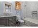 Stylish bathroom featuring gray cabinetry, white marble countertop and shower at 7482 S Mccormick Way, Queen Creek, AZ 85142