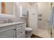 Bright bathroom with white cabinets, a marble countertop, and a glass-enclosed shower with tiled walls at 7482 S Mccormick Way, Queen Creek, AZ 85142