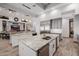 Kitchen island features marble countertops and stainless steel appliances at 7482 S Mccormick Way, Queen Creek, AZ 85142