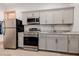 Functional kitchenette with modern appliances and gray cabinetry, perfect for small meals at 7482 S Mccormick Way, Queen Creek, AZ 85142